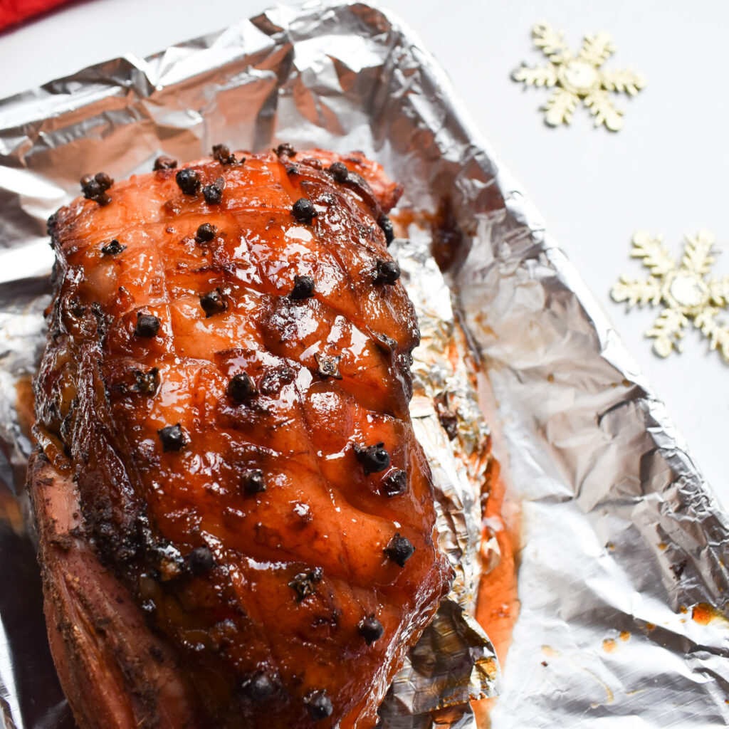 Honey Glazed Ham in roasting tin.