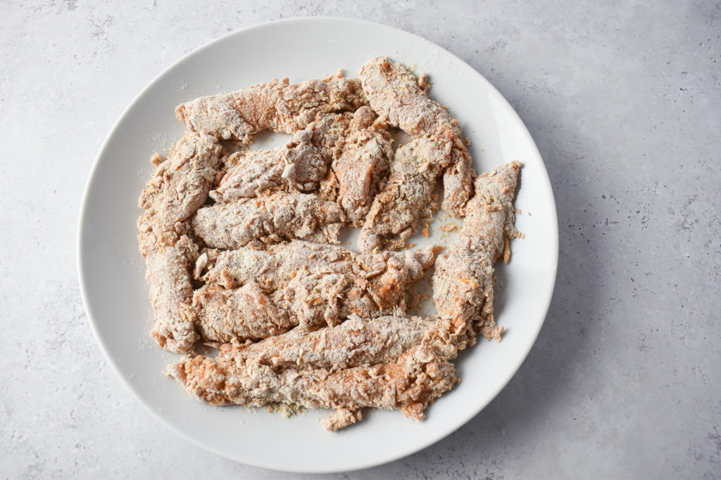 raw chicken strips with coating