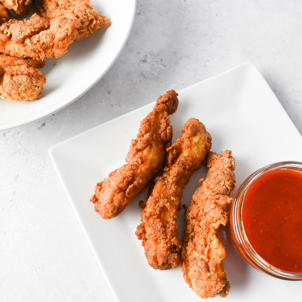 crispy chicken tenders and sriracha sauce