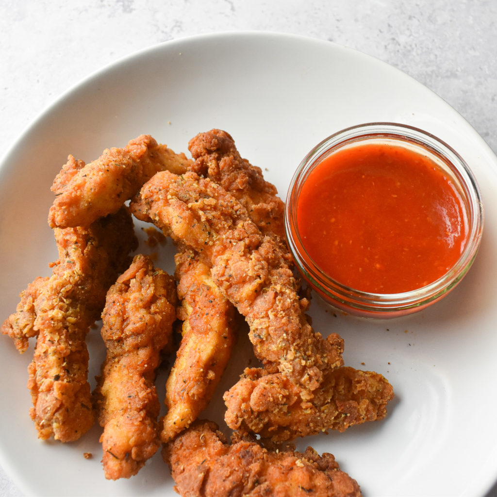 crispy chicken tenders and sriracha sauce