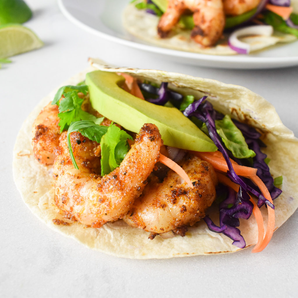 Prawn tacos with prawns, avocado and salad.