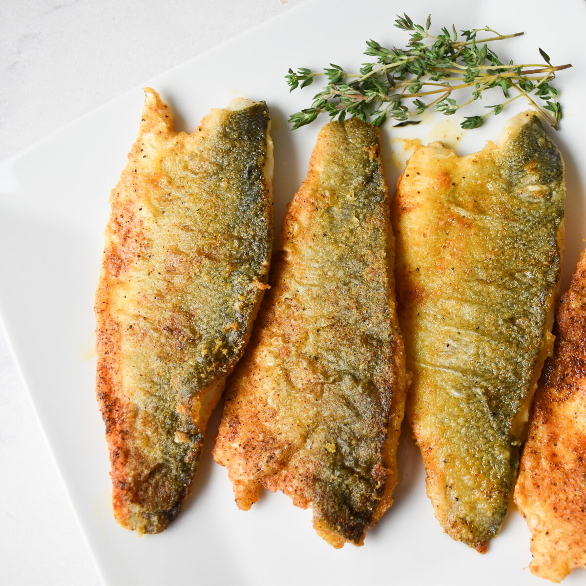 Lightly Dusted Pan-Fried Sea Bass Fillets - Andrea's Dainty Kitchen