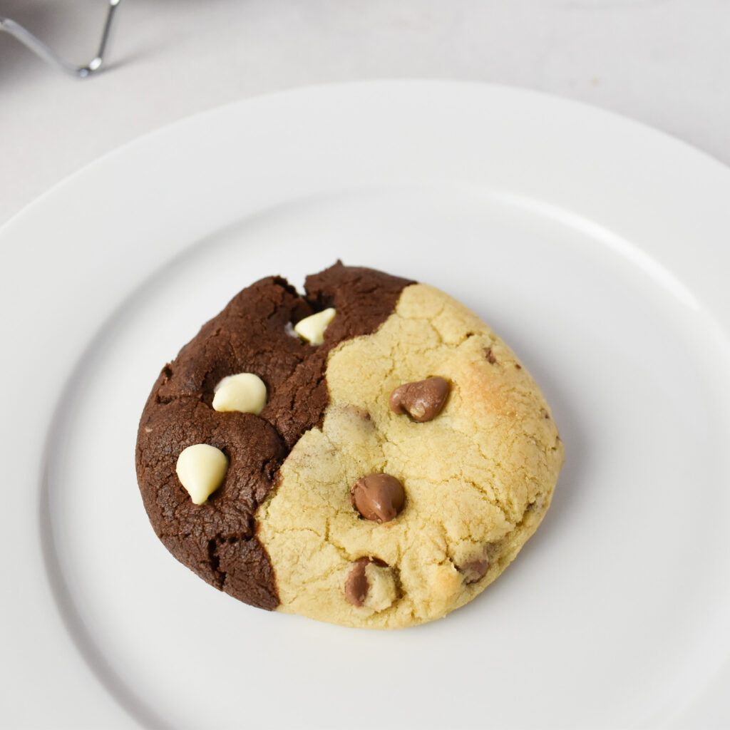Single chocolate chip swirl cookie on a plate.