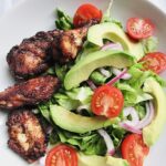 Chicken wings and avocado salad