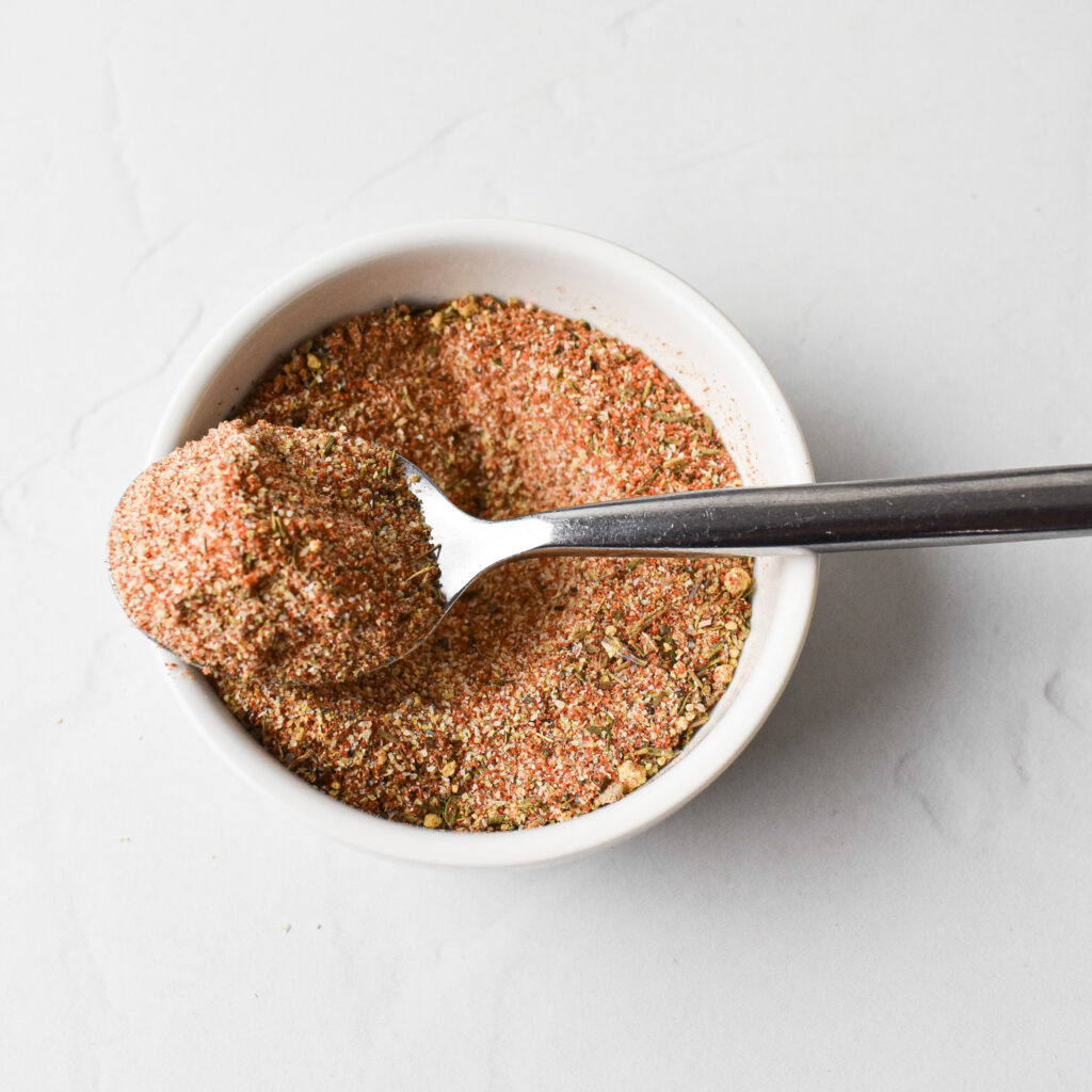 chicken seasoning in bowl with a spoon