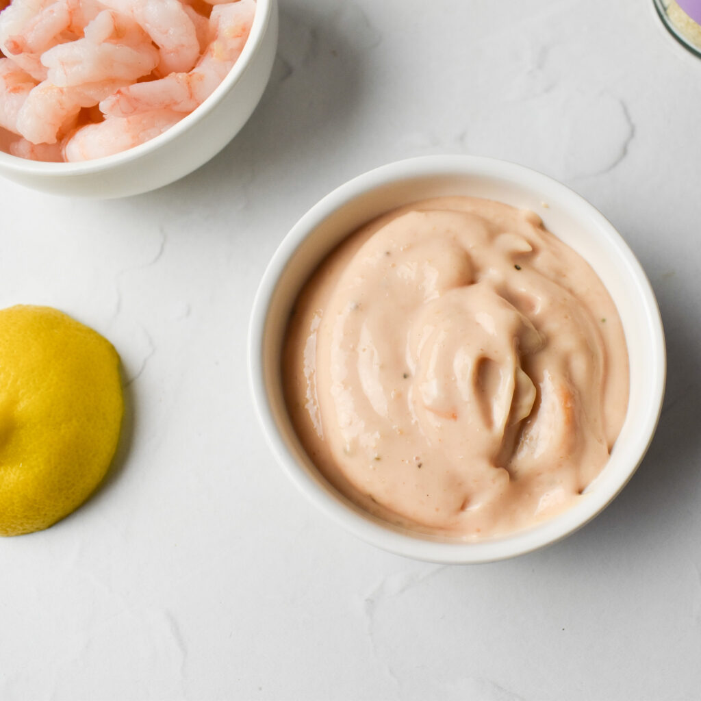 Seafood sauce in ceramic pot and prawns