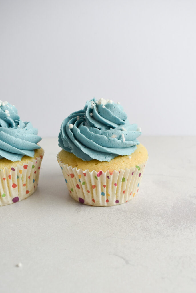 Vanilla cupcakes with buttercream frosting.
