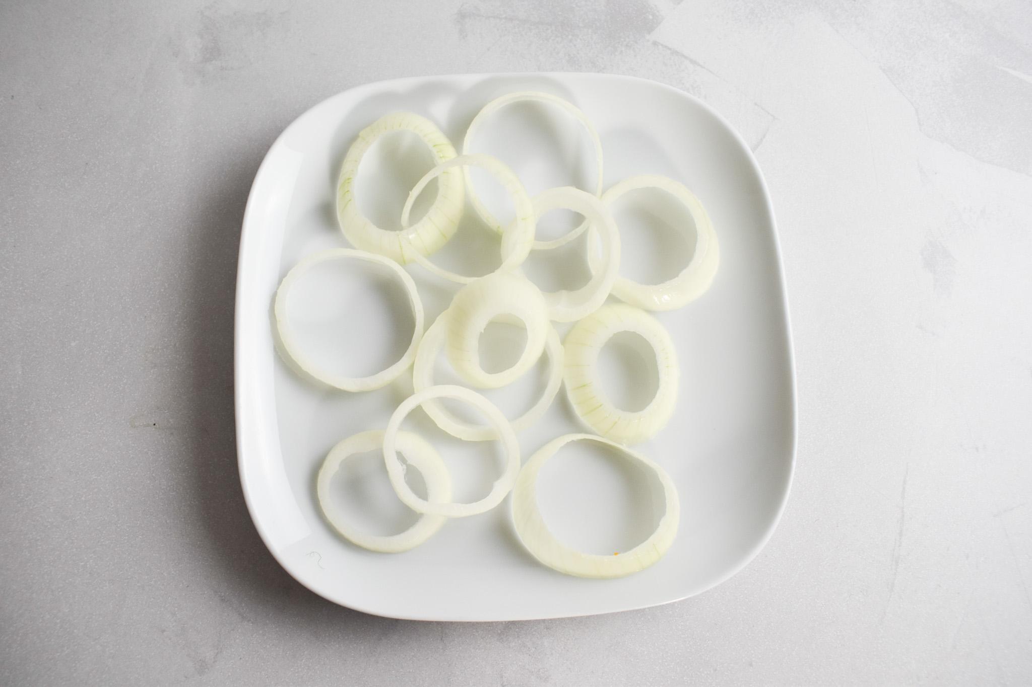 Onion slices on plate.