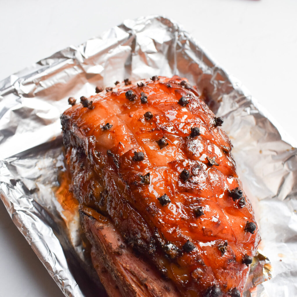 Honey Glazed Ham in roasting tin.