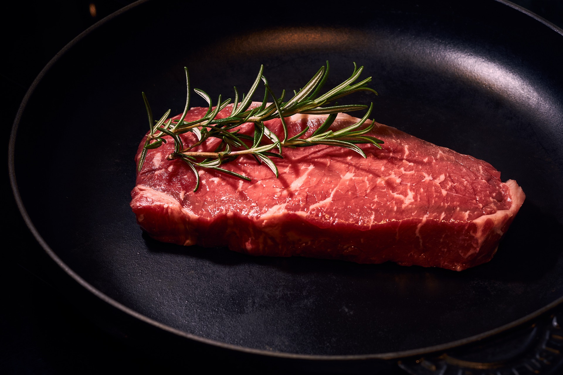 raw meat in pan