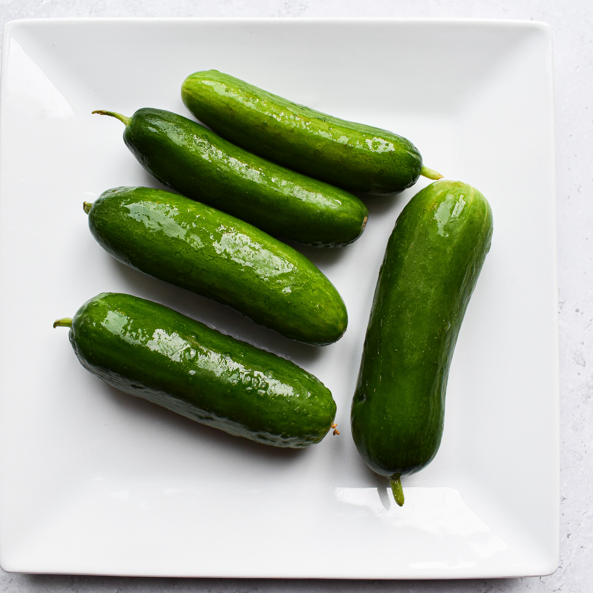 Baby cucumbers on a plate